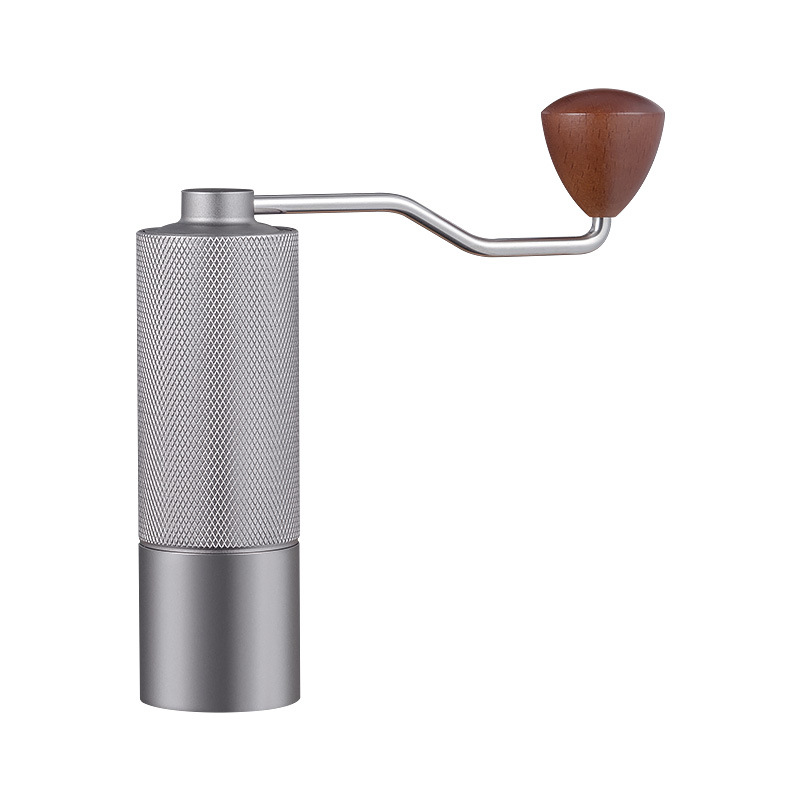 Manual coffee grinder with diamond-knurled stainless steel body and wooden knob